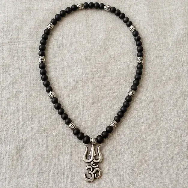 Indian cinema-inspired editorial styling with Karungali Mala with Om Shiva Trishul Pendant jewellery
