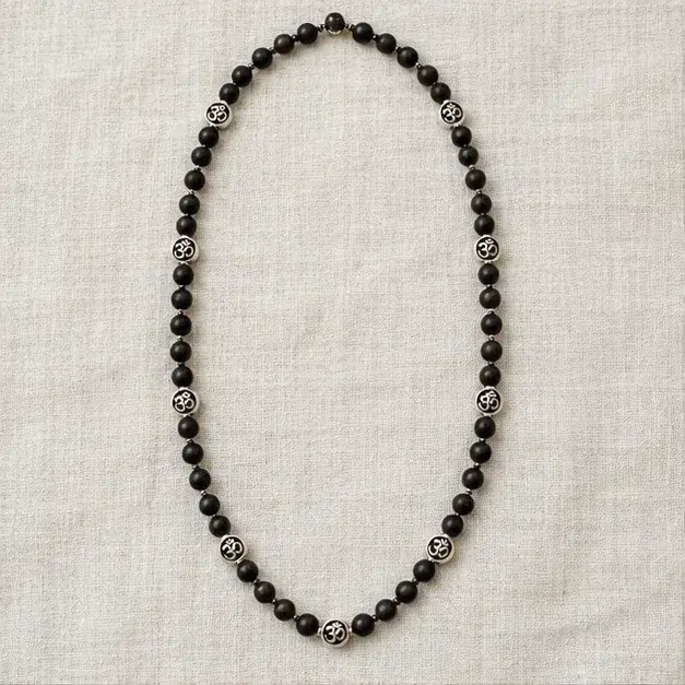 Indian cinema-inspired editorial styling with Om Bead Karungali Mala jewellery
